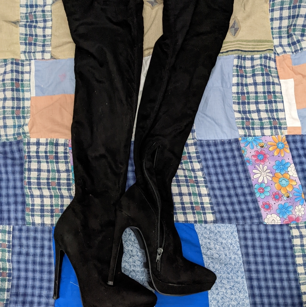 Thigh high heeled boots